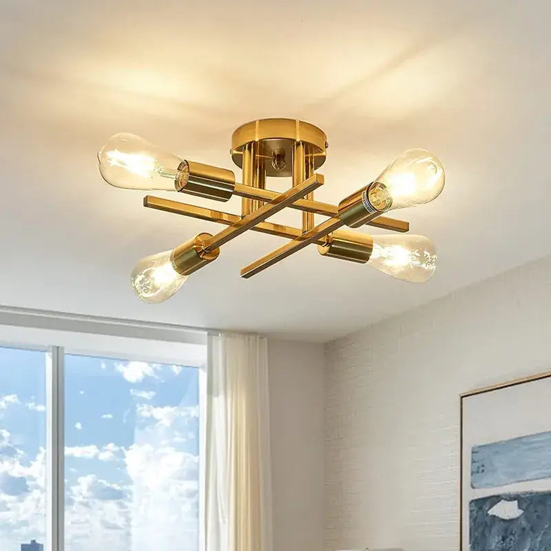Gold-toned DecorBites™ modern chandelier flush mount with four exposed filament bulbs in a cross pattern