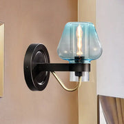 Modern blue glass wall sconce light fixture with tapered shade and black metal base for shade bedroom wall lighting