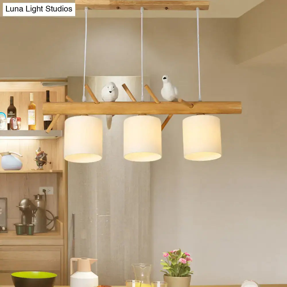 DecorBites modern branch island pendant light with cream glass shade and wooden frame with bird figurines for dining room