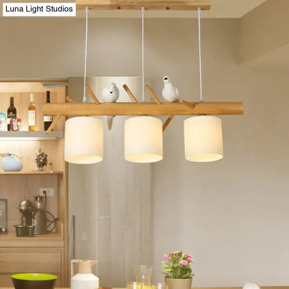 DecorBites modern branch island pendant light with cream glass shade and wooden frame with bird figurines for dining room