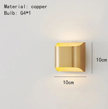 A sleek 10cm square DecorBites wall lamp in modern brass LED with geometric design and warm ambient lighting