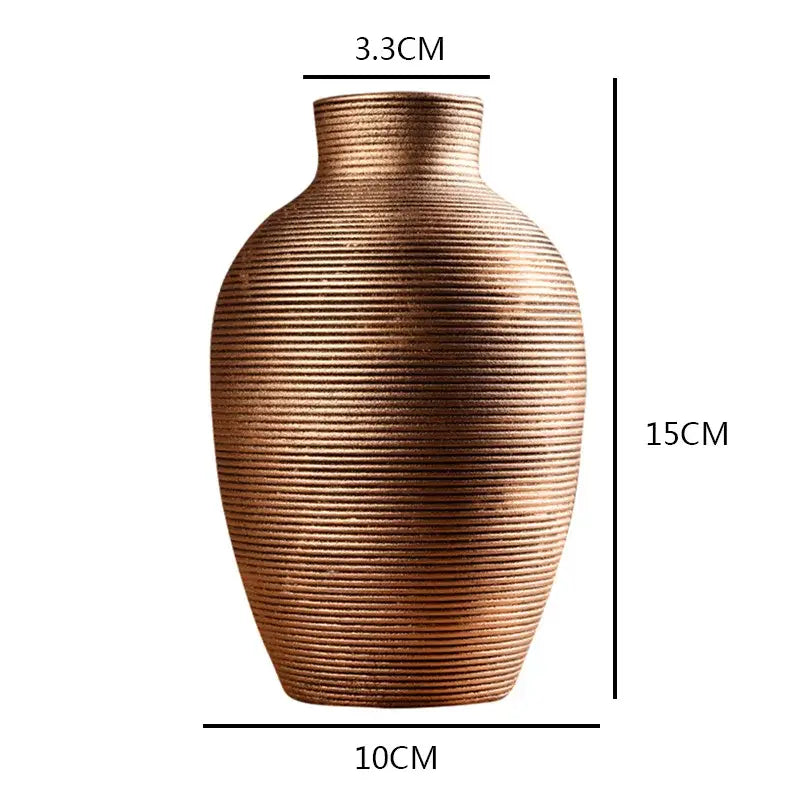 Bronze-colored ribbed ceramic vase with rounded body for modern home decor from decorbites ceramic nordic collection