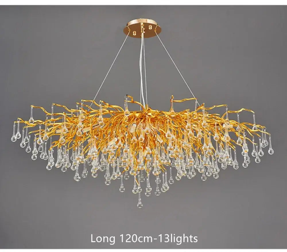 Golden branch-style crystal chandelier with dangling teardrop pendants in a DecorBites™ lamp package for living room