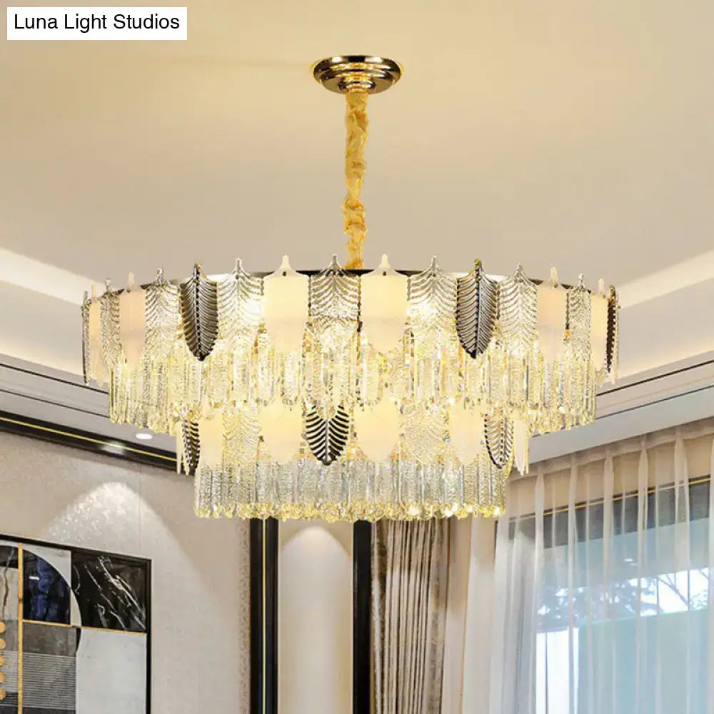 DecorBites modern clear crystal leaf pendant chandelier with gold-toned layered crystals and twisted brass chain ceiling light