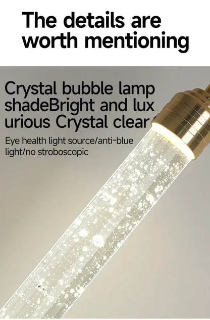 Decorbites™ modern crystal pendant light with gold fixtures featuring a clear glass shade filled with sparkling bubbles