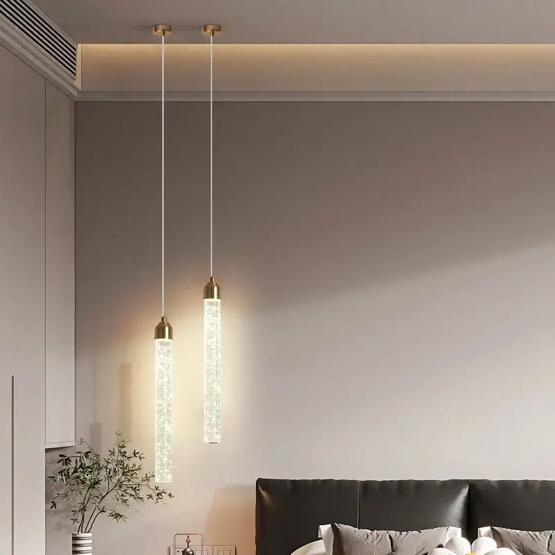 Decorbites™ modern crystal pendant light with gold fixtures featuring translucent crystal-encrusted cylindrical bodies