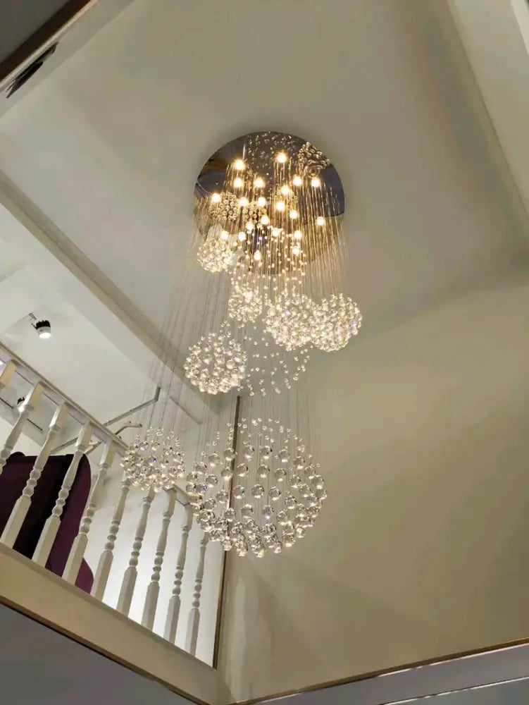DecorBites™ modern crystal chandelier with polished chrome base and LED bulbs for high ceiling spaces