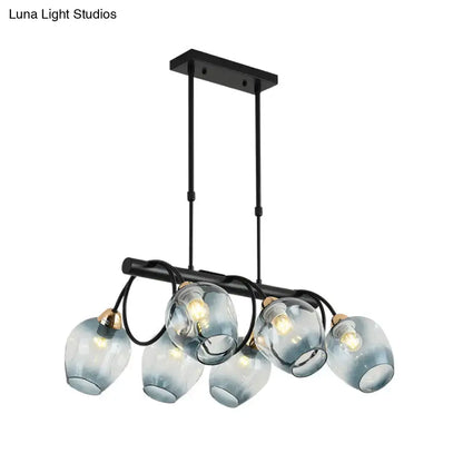 DecorBites modern black metal island light with five frosted blue glass globes and brass accents wine cup island light