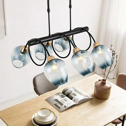Decorbites modern dimpled glass wine cup island light with five blue gradient glass shades and gold fixtures suspended
