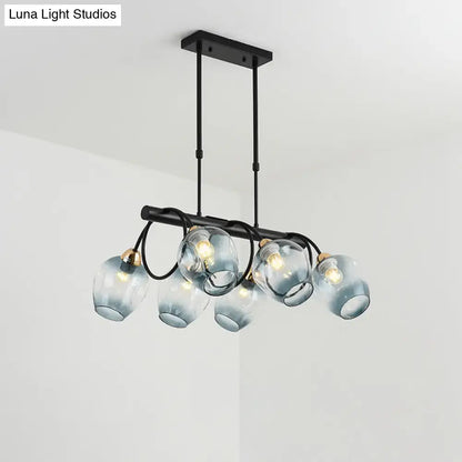 Modern black metal island light with five frosted blue glass globes and brass accents for cup island lighting