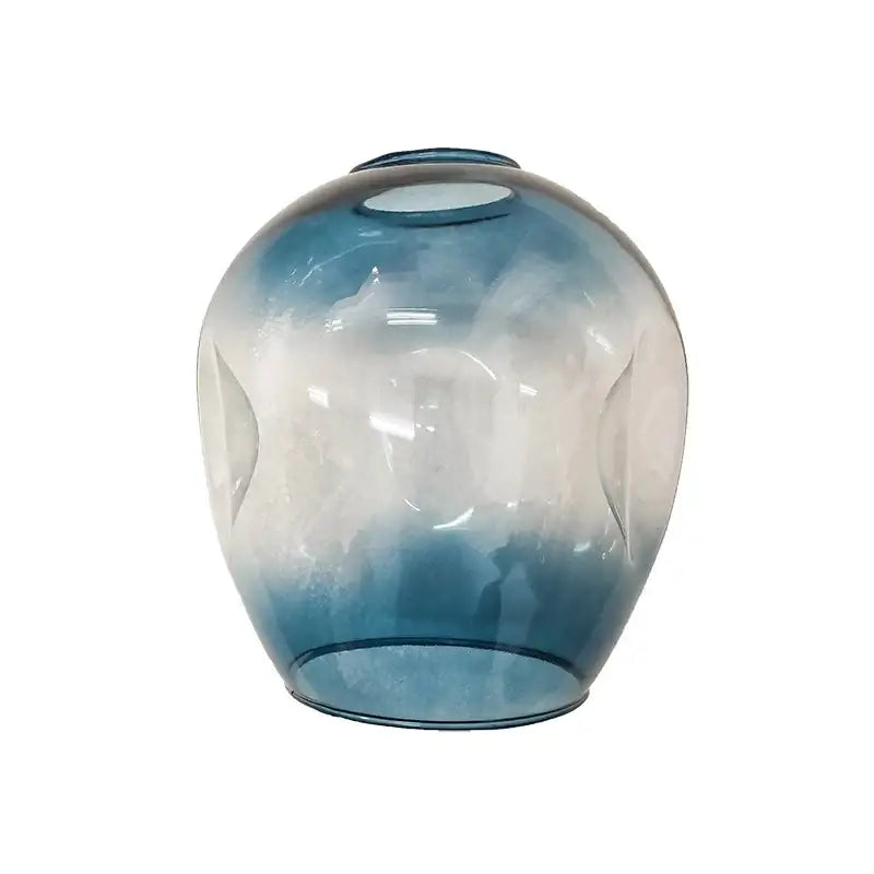 A translucent blue-to-clear gradient glass ball vase with sculpted curves in the decorbites black gold chandelier style