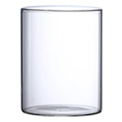 Clear cylindrical glass hydroponic vase with smooth transparent walls and rounded base for wedding decor by DecorBites