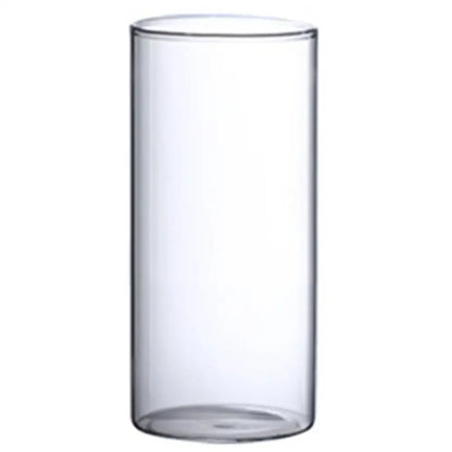 Clear cylindrical glass hydroponic vase with smooth transparent walls and rounded base for wedding decor by decorbites
