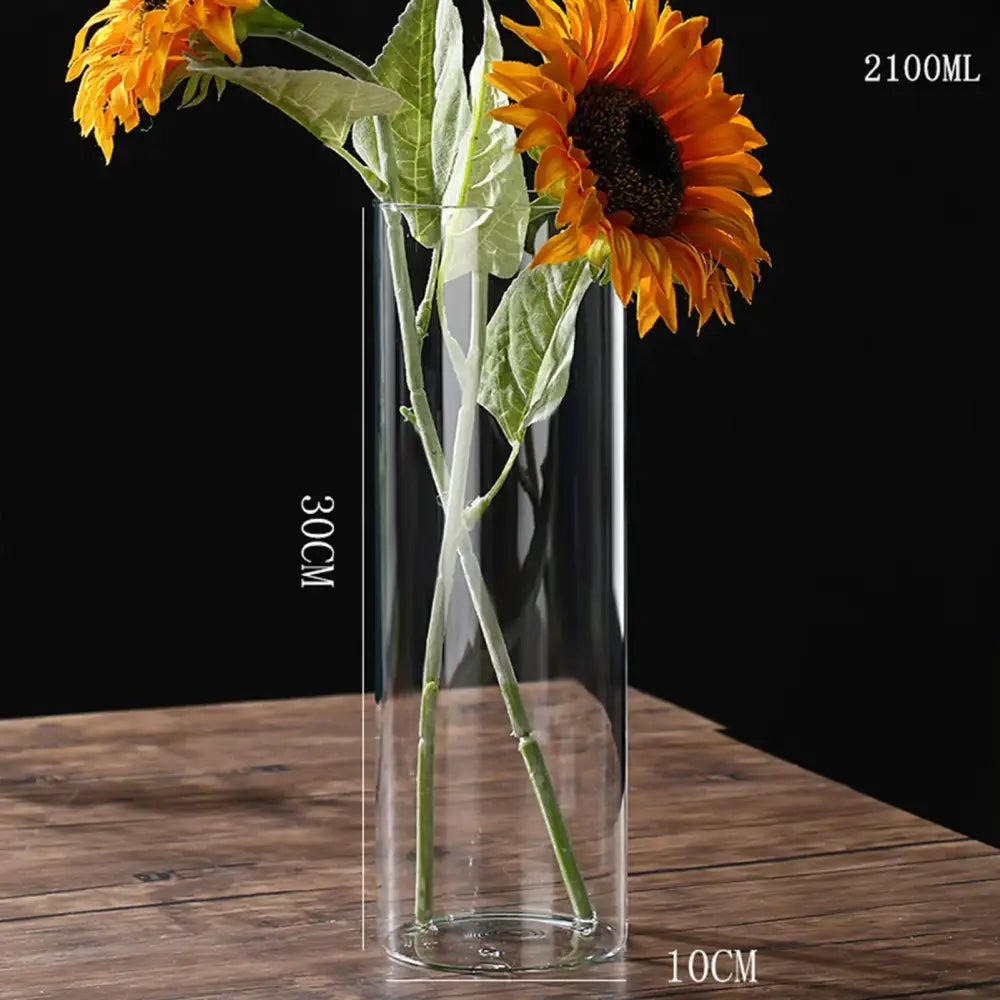 DecorBites™ modern clear glass hydroponic vase 30cm tall 10cm wide with vibrant orange sunflowers for wedding decor