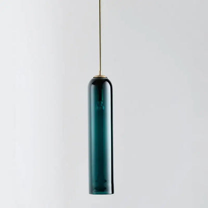 DecorBites modern pendant light in teal glass with brass suspension rod offers a sleek lighting solution