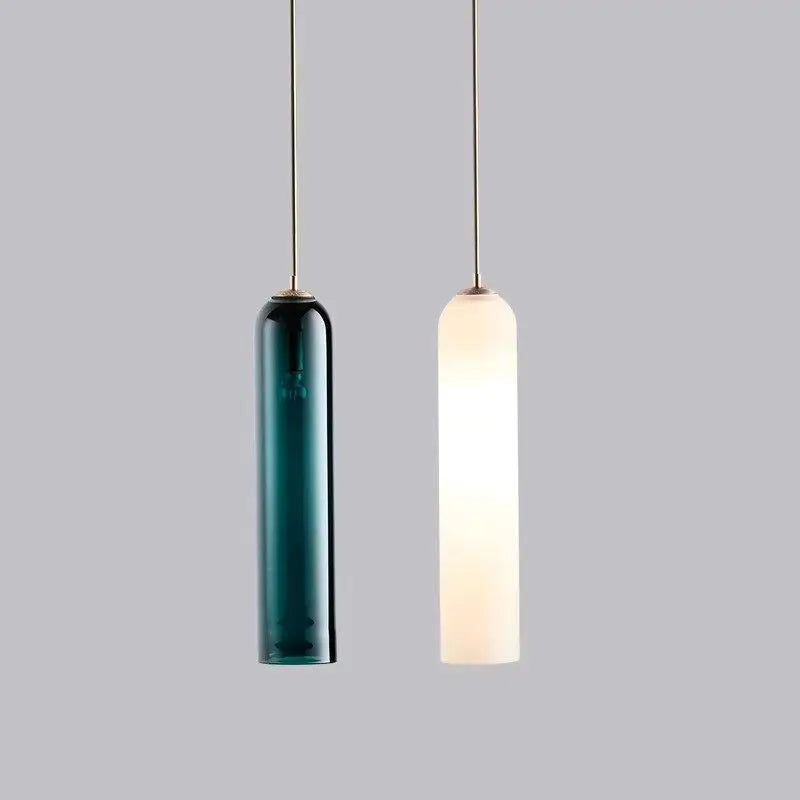Two cylindrical pendant lights in deep teal and frosted white glass by decorbites modern pendant light lighting solution