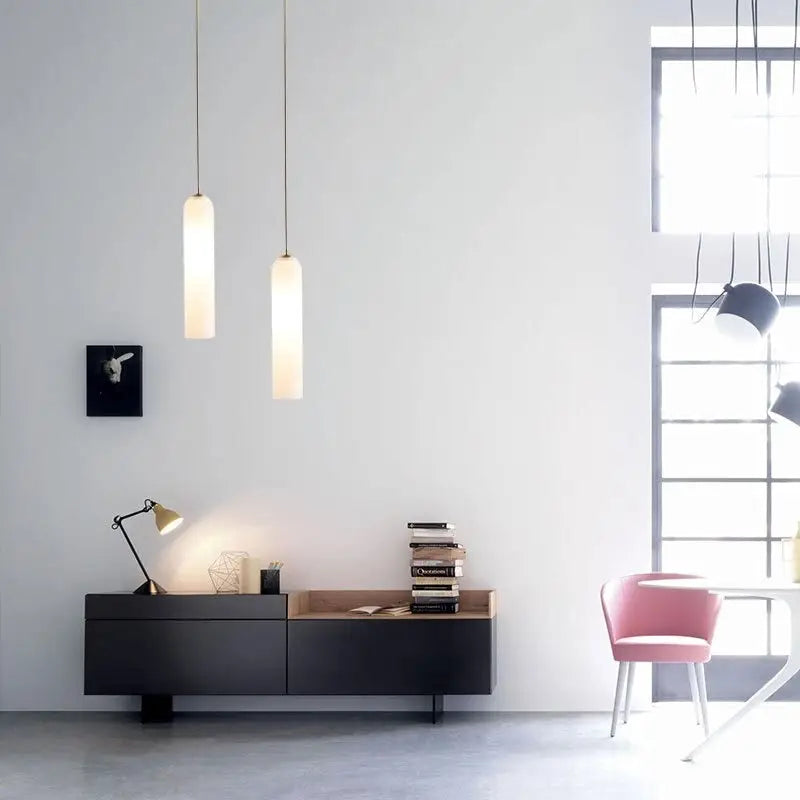 Two slender cylindrical frosted glass shades pendant light by decorbites modern lighting solution