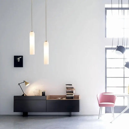 Two slender cylindrical frosted glass shades pendant light by decorbites modern lighting solution