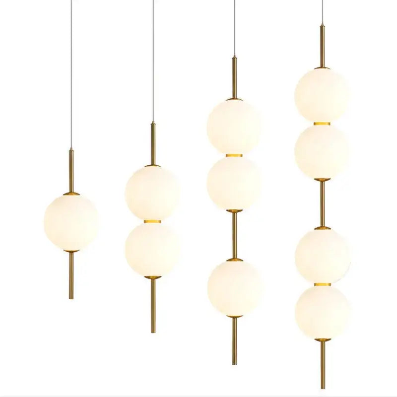 Decorbites™ modern glass pendant lighting with frosted glass spheres and brass accents for contemporary decor