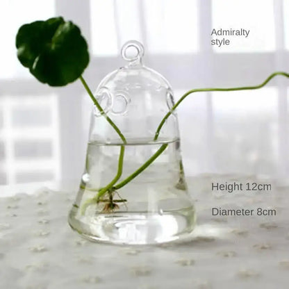 DecorBites™ modern clear glass vase terrarium with bell shape looped top and admiralty style design holding green stems