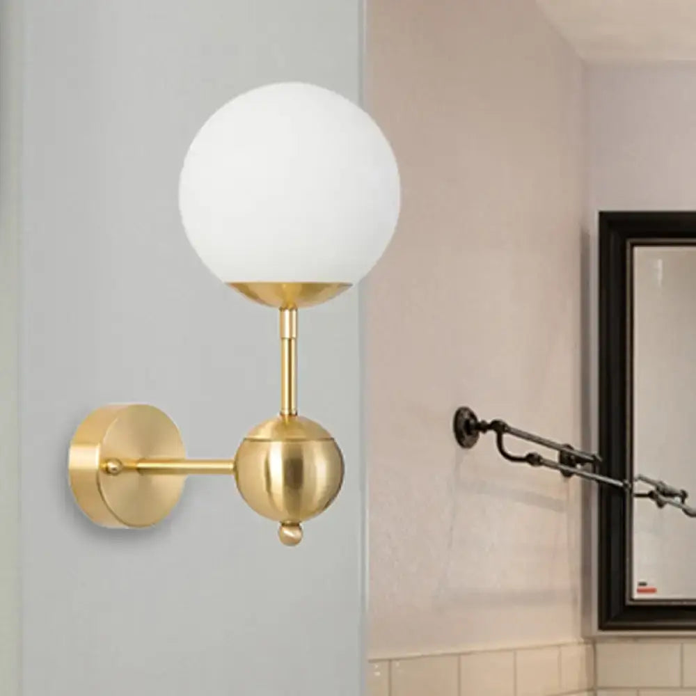 Modern brass and white glass globe sconce bathroom led light with gold-toned direct wired frosted glass shade and brass accents