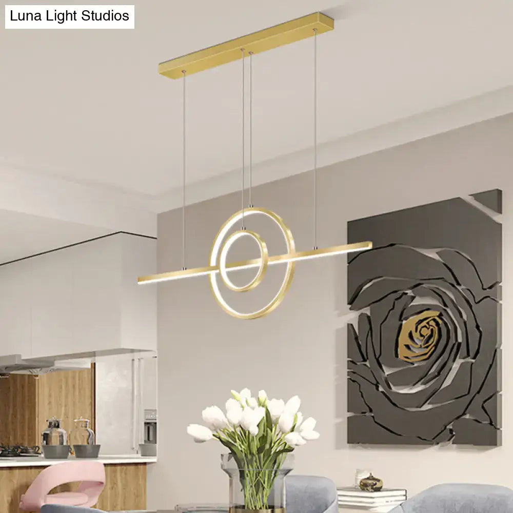 Modern gold-toned lighting fixture with sleek geometric gold 2-ring island design for dining room decor