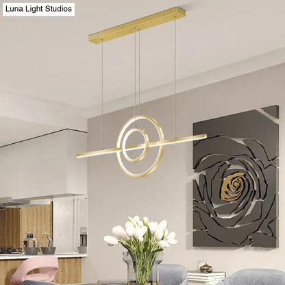Modern gold-toned lighting fixture with sleek geometric gold 2-ring island design for dining room decor