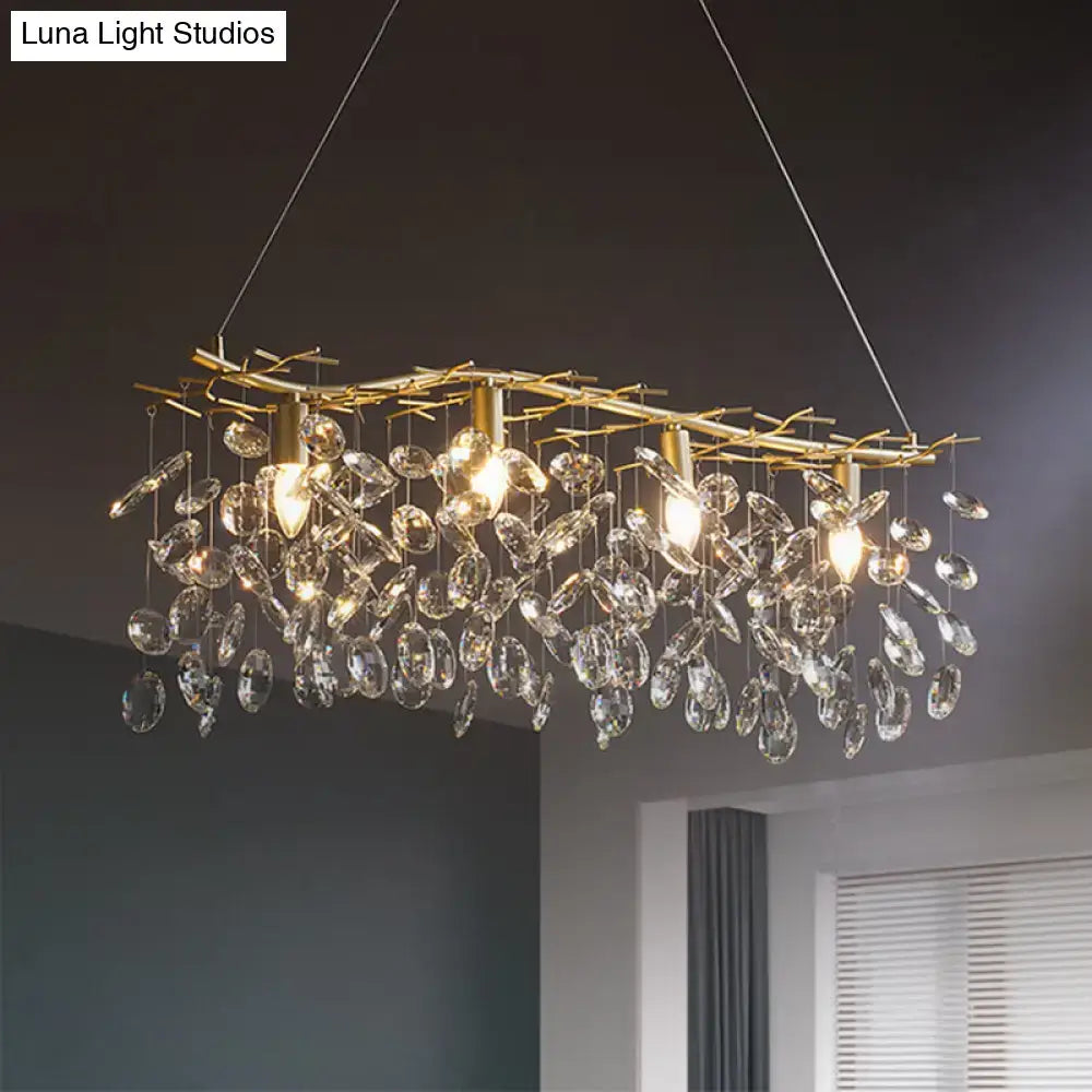 Gold-toned DecorBites™ island hanging lamp with branch-like frame and crystal droplets for modern interiors
