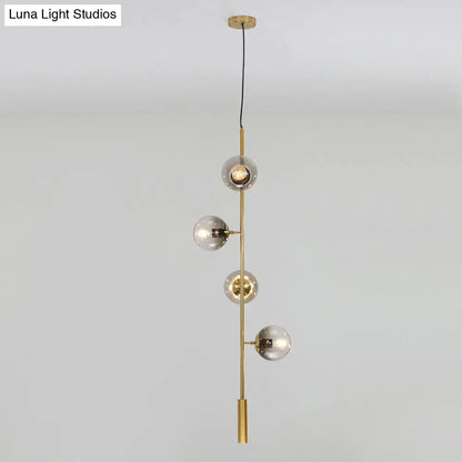DecorBites modern gold linear chandelier with four gray glass shades and brass rod metal hanging fixture