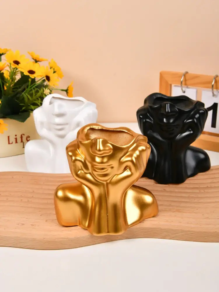 Golden resin vase decorbites™ modern human body shape with stylized face and clasped hands for body shaping decor