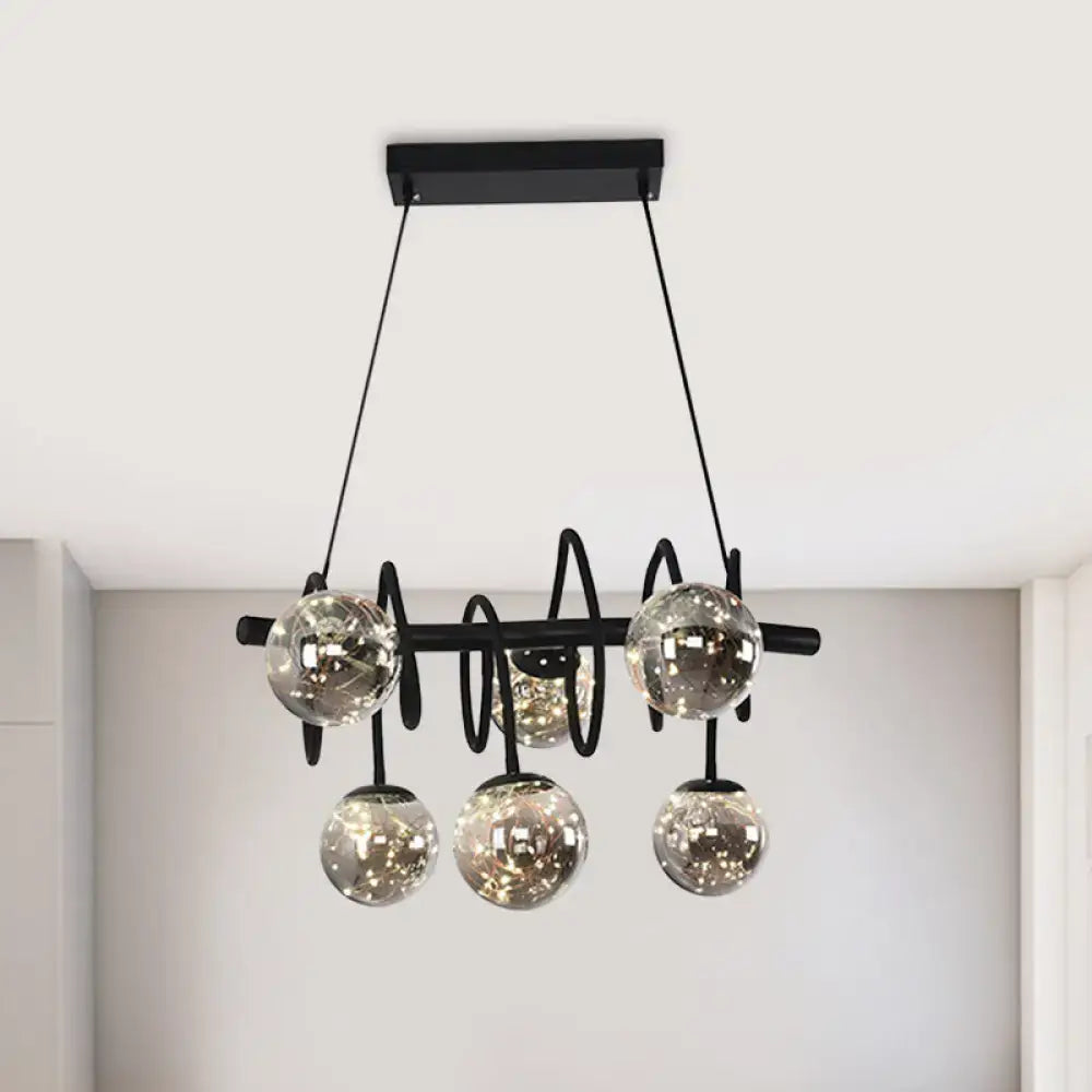 Black metal chandelier with five smoke gray glass shade globes ideal for modern dining room lighting