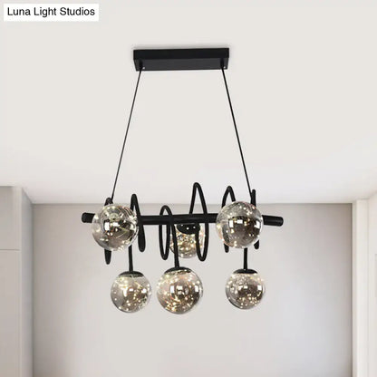Decorbites modern island pendant light with black metal frame and smoke gray glass shade with five globe lights