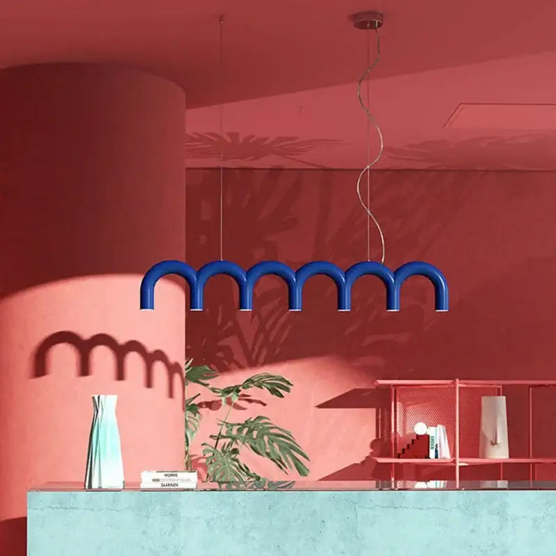 Blue curved pendant light from decorbites modern led oblure arch chandelier in blue with sleek design hanging from ceiling