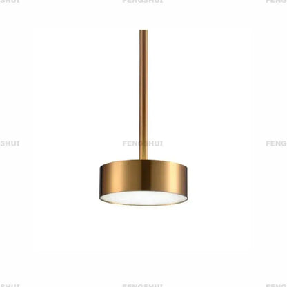A sleek cylindrical pendant light with brushed gold finish and frosted glass diffuser for modern led bubble living room