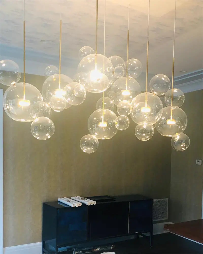 DecorBites™ modern led bubble chandelier with transparent glass spheres and gold-toned rods in warm decor led lighting