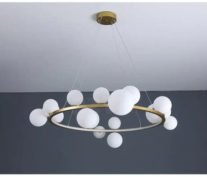 DecorBites™ modern gold-toned chandelier with clear glass frosted spheres and adjustable cord for versatile lighting