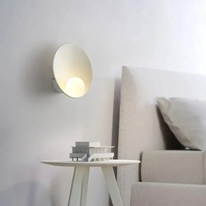 Minimalist white decorbites™ led wall light with smooth circular design and warm ambient lighting for modern interiors