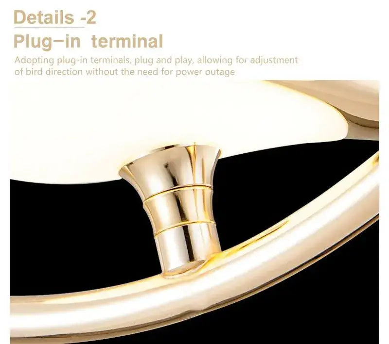 Gold-colored metallic plug-in terminal with sleek cylindrical design and ridges for DecorBites™ magpie bird led pendant light