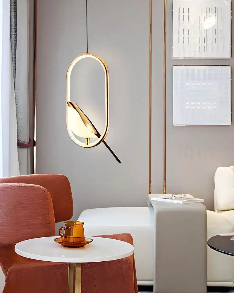 Gold-toned oval DecorBites modern magpie bird led pendant light with sleek design and warm ambient glow