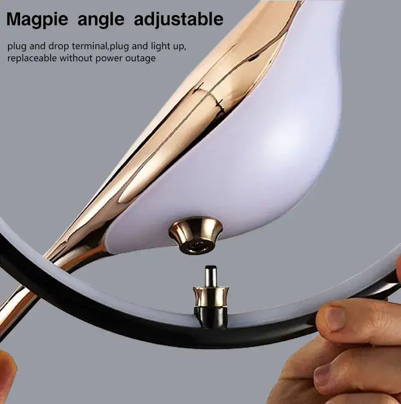 DecorBites™ magpie bird led pendant light with a curved gold metal arm and white frosted glass shade
