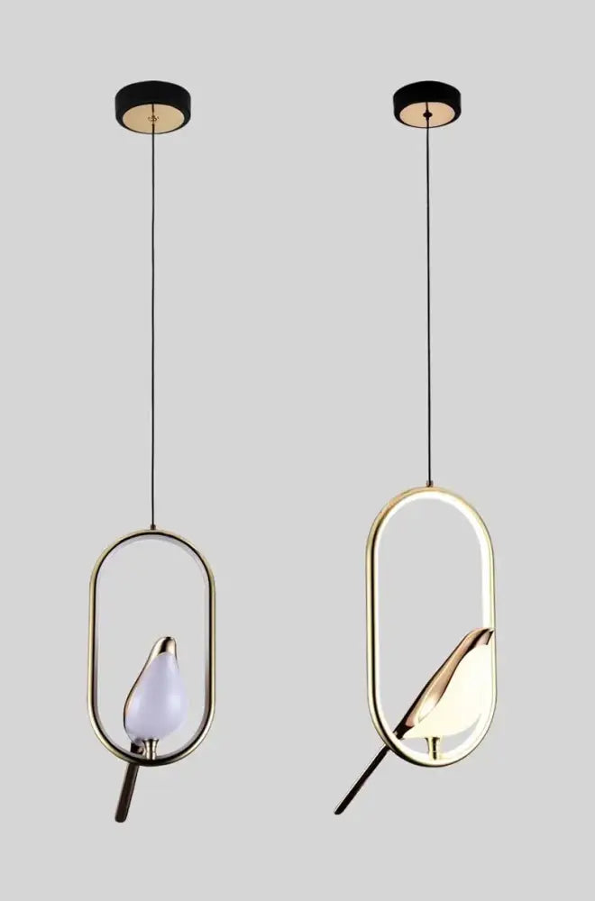 Two gold-toned decorbites™ modern magpie bird led pendant lights with oval frames and illuminated bird-shaped bulbs