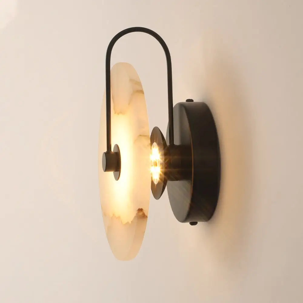 DecorBites modern marble wall lamp with warm-toned alabaster shade and black metal frame for stylish marble wall decor