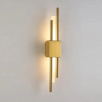 Decorbites™ modern metal wall lamp in gold with sleek vertical rods and central square base emitting warm light