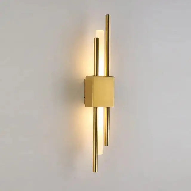 Decorbites™ modern metal wall lamp in gold with sleek vertical rods and central square base emitting warm light
