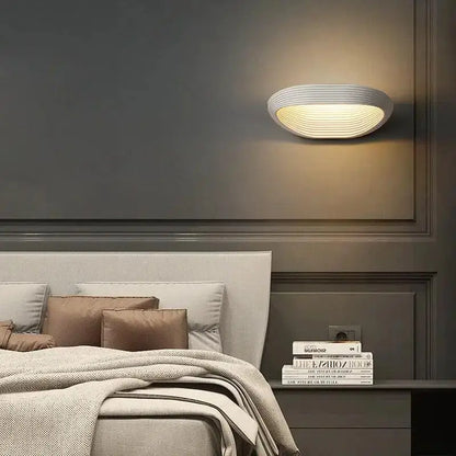 Decorbites™ modern minimalistic wall sconces with oval ribbed white ceramic finish providing warm ambient lighting