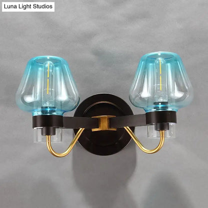 Decorbites modern mushroom direct wired bedroom sconce with turquoise glass shades and gold accented black metal frame