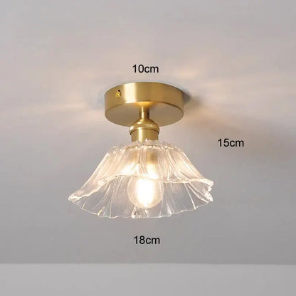 A delicate clear glass fluted lampshade with brass finish hanging e27 ceiling light from DecorBites modern nordic collection