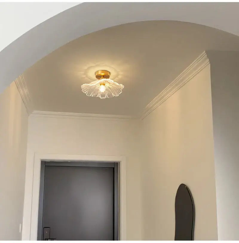 A delicate translucent glass ceiling light with golden brass petal design from decorbites™ modern nordic e27 ceiling lights
