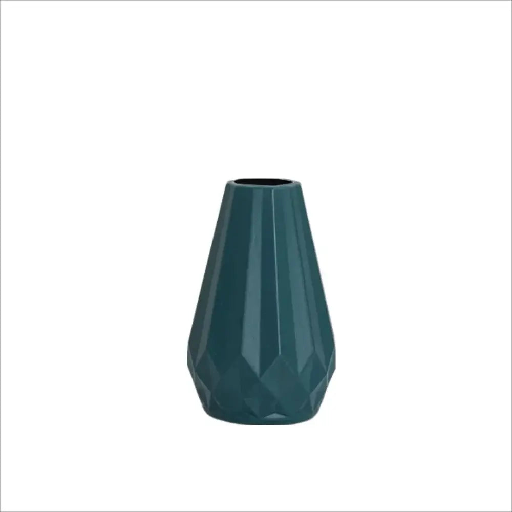 A sleek dark teal ceramic diamond shaped flower vase with faceted geometric design by DecorBites™