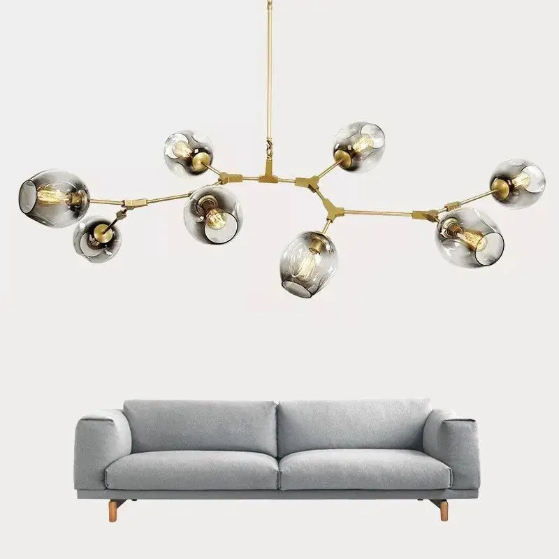 Modern brass DecorBites™ nordic glass ball LED chandelier with multiple smoked glass globe shades and exposed bulbs
